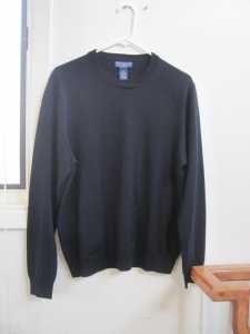 Here is your classic black merino wool sweater.