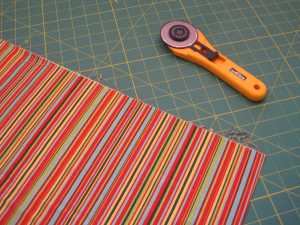 Again, I iron the fabric. I only fold it once, just like it came off the bolt. I straighten the edge but I do not use a ruler to do so.